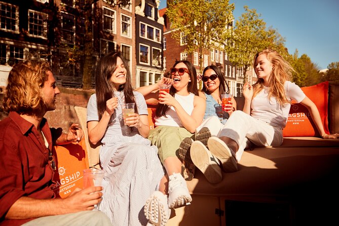 Amsterdam Classic Saloon Boat Canal Cruise with Live Guide - Live guiding, humor, and practical city advice