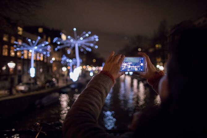 Amsterdam Light Festival: Canal Cruise + Bite & Unlimited Drinks - Seeing Amsterdam’s lights from the canal