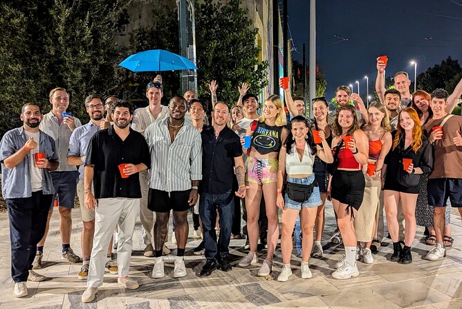 Athens Pub Crawl with 1hr Open Bar & VIP Nightclub Access - Moving through Psirri after dark