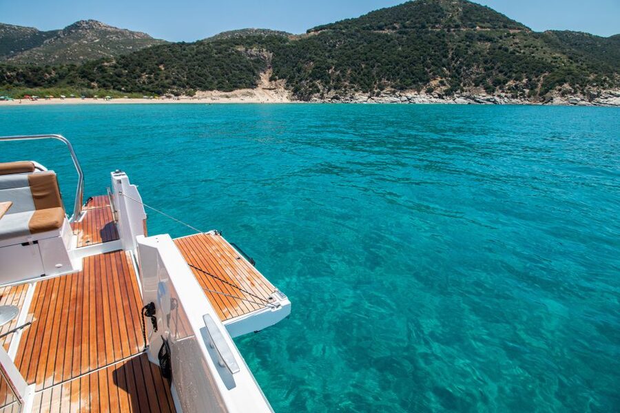 Cagliari: Luxury Motorboat Tour with 3 Swim Stops & Wine - The boat ride past Poetto and the Devil’s Saddle