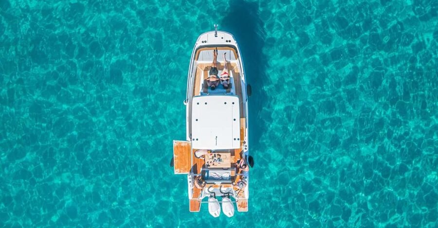 Cagliari: Luxury Motorboat Tour with 3 Swim Stops & Wine - Cala Fighera: cliffs, clear water, and more time afloat