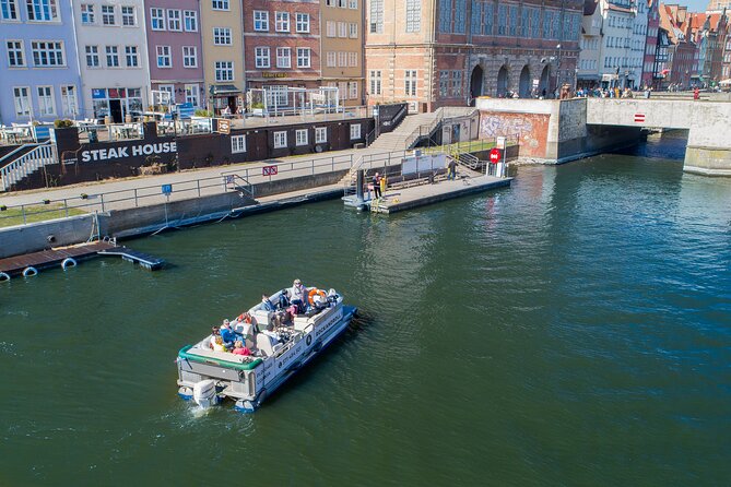 Cruises on the Motlawa River by a luxury catamaran - Gdańsk from the water side - The medieval Crane from the water
