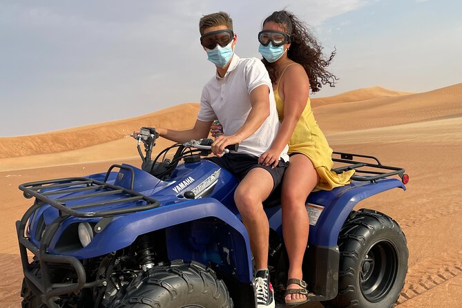 Desert Safari, Quad Biking (30 mins) & VIP BBQ Dinner Experience - Camel rides, falcon photos, and sunset stops