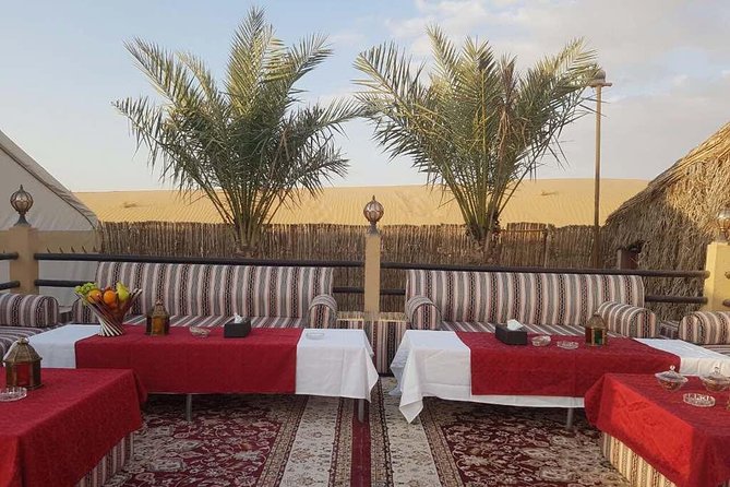 Dubai Desert Safari evening with VIP Treat , BBQ Buffet and Exciting Liveshows - Sunset photographs, Arabic dress, and desert views