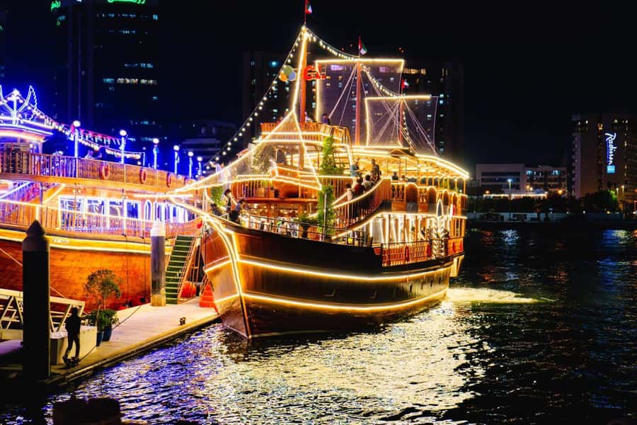 Dubai: Luxury Dinner Cruise with Live Music - Dubai Creek after dark, from an old wooden dhow