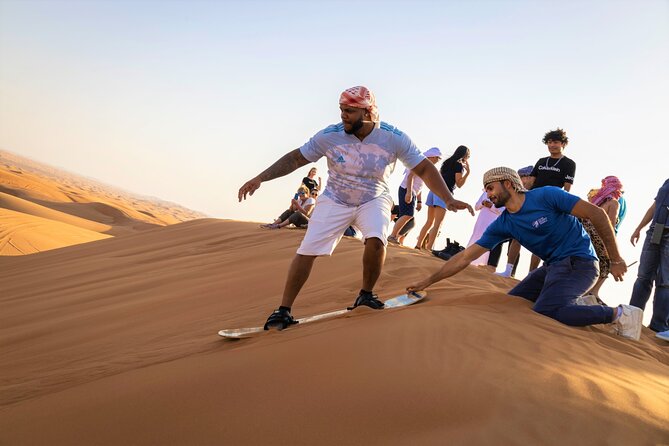 Dubai Red Dunes with Sandboarding, Camel Ride, Falcon & VIP Camp - Lahbab’s red dunes and the tire-pressure stop