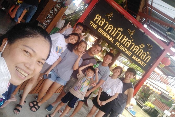 Floating & Railway Markets and Erawan Waterfall [Optional Luxury] - Taking a motorboat through Damnoen Saduak