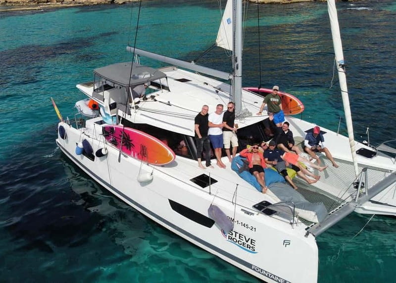 From Palma: Luxury Catamaran Group Tour with Tapas & Drinks - The bay stop: swim first, then settle in