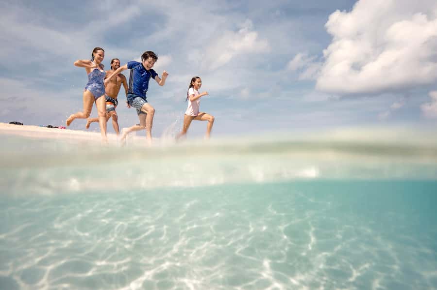 From Port Douglas: Outer Reef Cruise by Luxury Catamaran - Sailing beside the Daintree Mountains