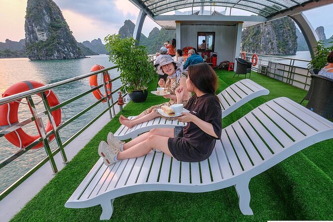 Halong Bay Cruise Luxury Full Day Tours - Limestone islands, open water, and cave scenery