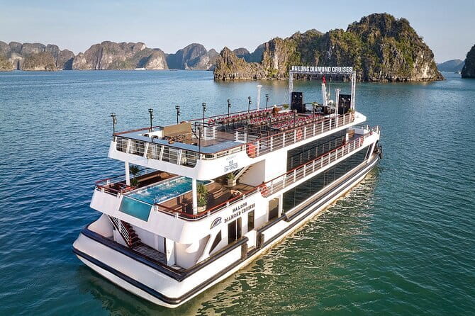 Halong Bay Day Tour Luxury Cruise With Jacuzzi and Buffet Lunch - Fruit, cake, and sunset on the return cruise