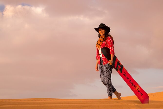 High Red Dunes with Camel Ride, Sandboarding, Falcon Show and VIP BBQ Dinner - Dinner, VIP seating, and evening entertainment