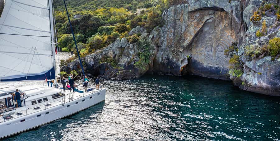 Lake Taupo: Luxury Sailing Catamaran to Māori Rock Carvings - The swim stop in a calm bay