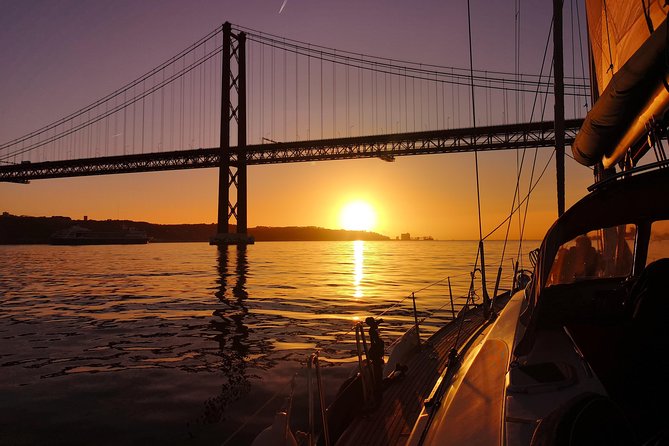 Lisbon Sunset Sailing Tour on Luxury Sailing Yacht with 2 Drinks - Wine, beer, cheese, and the sunset pause