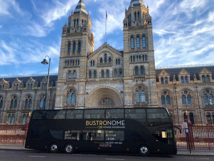 London: 4 Course Lunch Tour by Luxury Coach Bustronome - A dining room with London moving past the windows