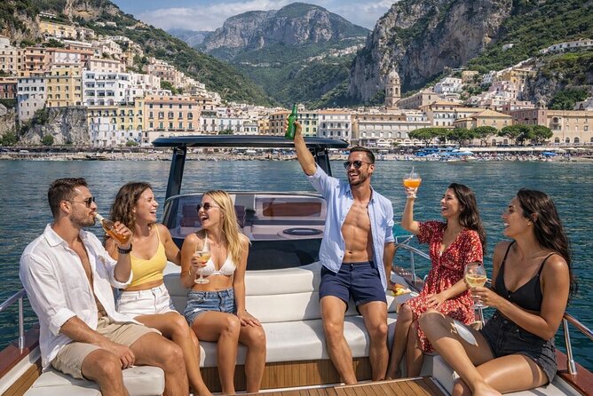 Luxury Amalfi Coast Boat Tour with Swim & Prosecco – Small Group - The approach to Positano and Li Galli