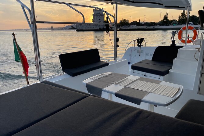 LUXURY Catamaran Sunset and Wine cruise - Lisbon’s central waterfront after dark