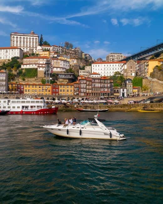 Luxury Douro Yacht Tour: Scenic Views & Complimentary Drinks - Passing beneath six Porto bridges