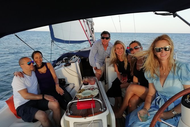 Luxury Private Sunset Cruise in Barcelona – Open Bar Included - Hoisting the sails beyond the north entrance