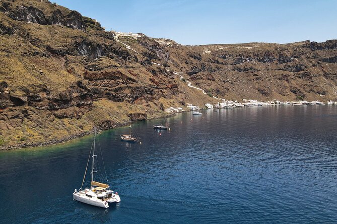 Luxury Santorini Sunset Cruise: Dinner, BBQ, Open Bar, Transfers - Mesa Pigadia and the southern coast