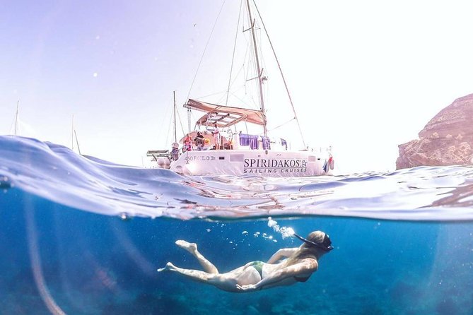 Luxury Small-Group Catamaran Cruise with BBQ, Open bar & Transfer - Why seeing Santorini from the sea matters