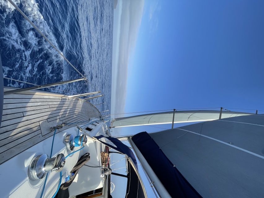 Madeira: Luxury Yacht & Sailing Sunset Tour - A welcome drink before the coast opens up