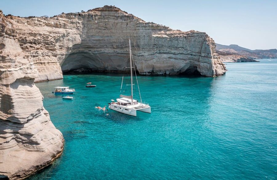 Milos: Full Day Luxury Catamaran with Full Meal & Open Bar - Adamantas departure and the first hour at sea