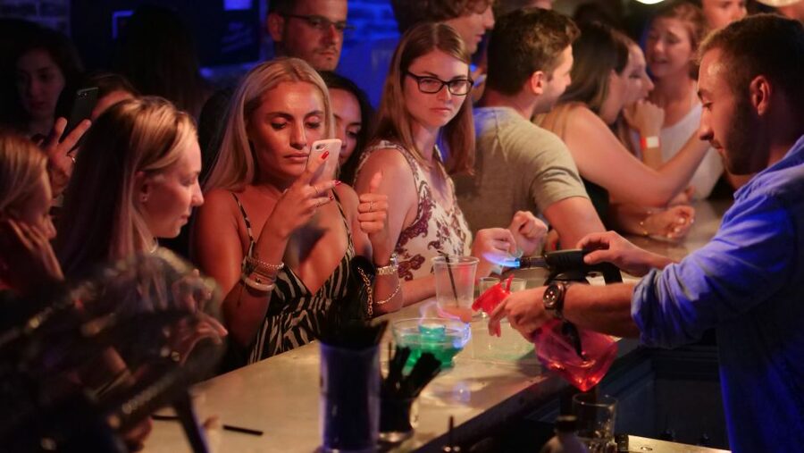Nice: Ultimate Party Bar Crawl Free Shots & VIP Club Entry - Walking through Place Massena and the seafront