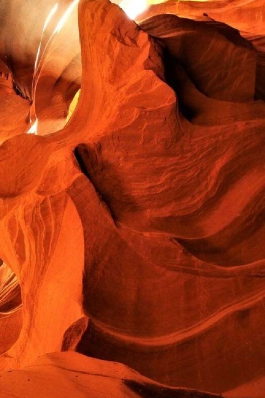 Page: Upper Antelope Canyon Prime Time Entry & Navajo Guide. - Walking through the sculpted sandstone