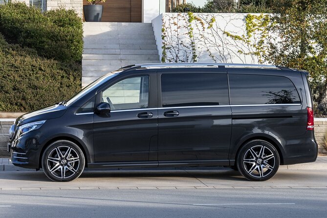 Paris Airport Transfer: Paris Airport CDG to Paris by Luxury Van - Arriving at Charles de Gaulle with a driver waiting