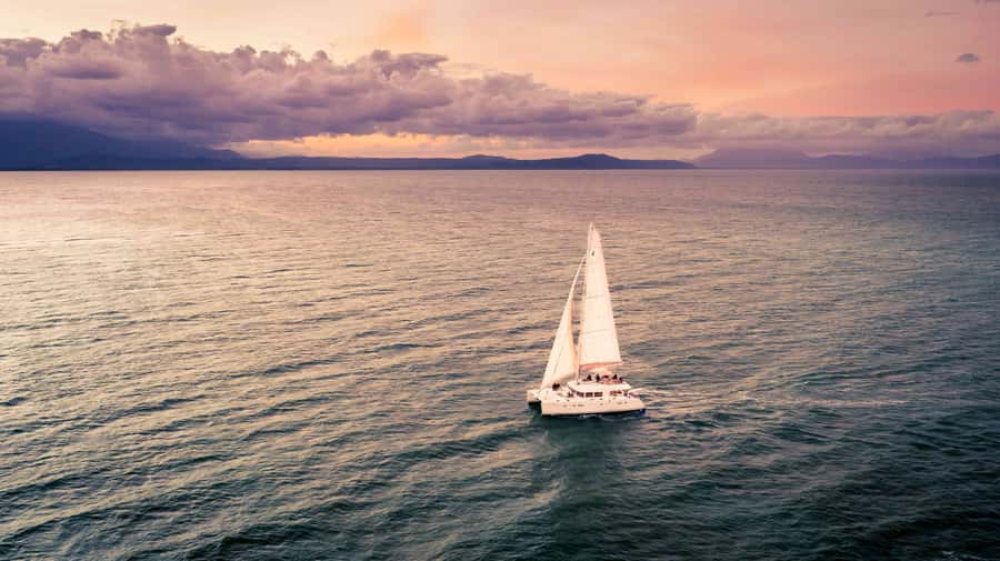 Port Douglas: Sunset Sailing Cruise on Luxury Catamaran - Sunset timing and the return to Port Douglas