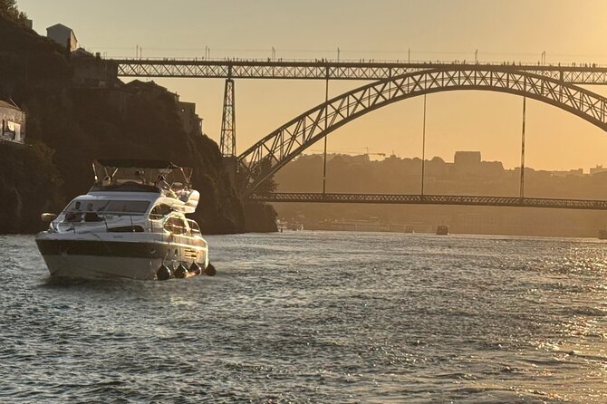 Porto: Luxury Yacht Cruise with Wine Tasting & Snacks - The crew makes the small boat work