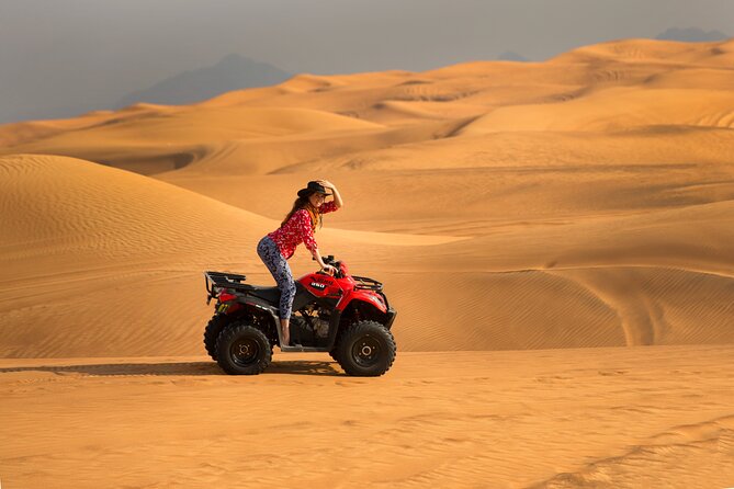 Premium Dubai Red Dunes with quadbike, camel ride and VIP Dinner - Sunset with coffee, dates, and a falcon