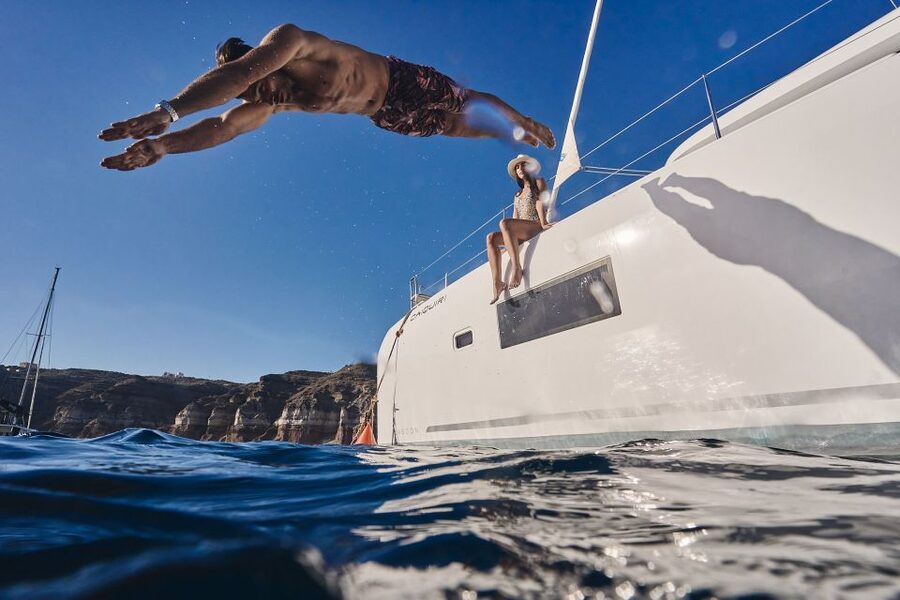 Santorini: Caldera Luxury Catamaran Cruise w/ Meal & Drinks - From your hotel to Vlichada Marina