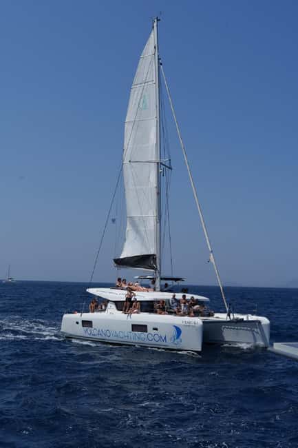 Santorini: Luxury Caldera Cruise With Meal & Drinks - Red Beach and the southern volcanic coast