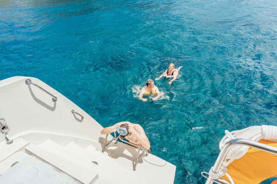 Santorini: Luxury Catamaran Day Trip with Meal and Open Bar - The Greek meal and open bar