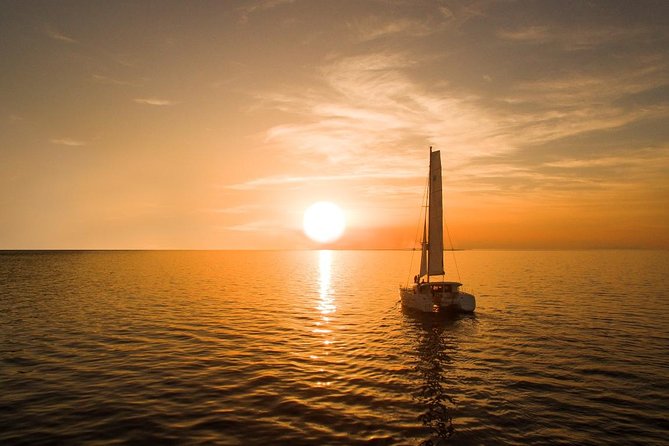 Santorini Luxury Catamaran Sunset Cruise with BBQ, Drink and Transfer - Swimming near the Palea Kameni hot springs