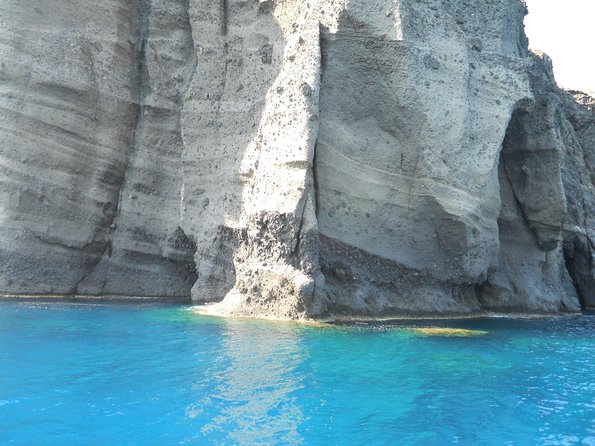Santorini Luxury Catamaran Sunset Cruise with BBQ, Drink and Transfer - Red Beach from the sea