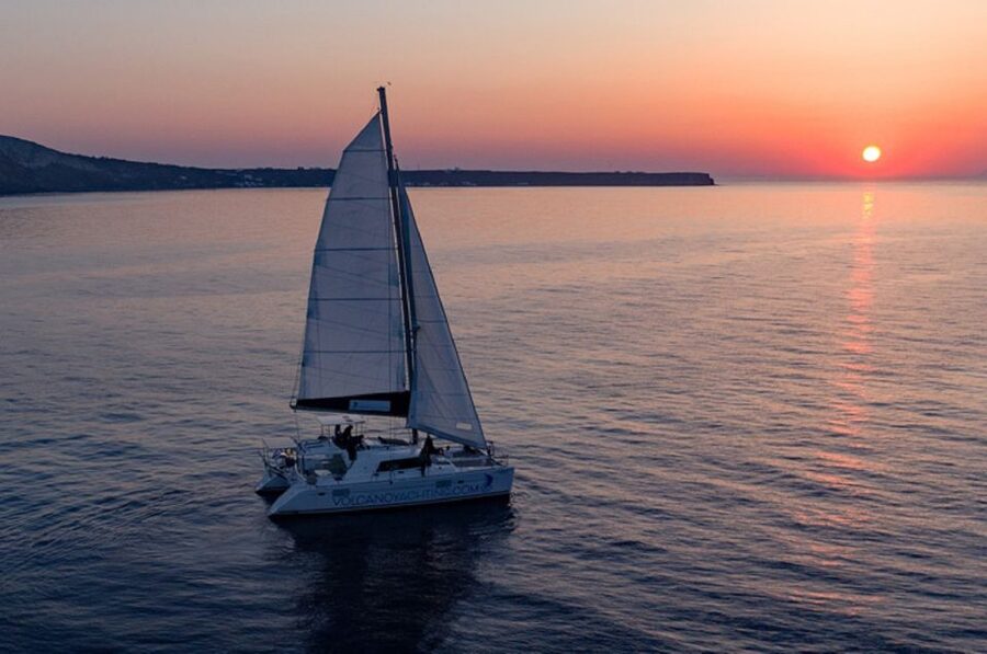 Santorini: Luxury Sunset Cruise with Dinner & Open Bar - Sailing past Thirassia and the caldera cliffs