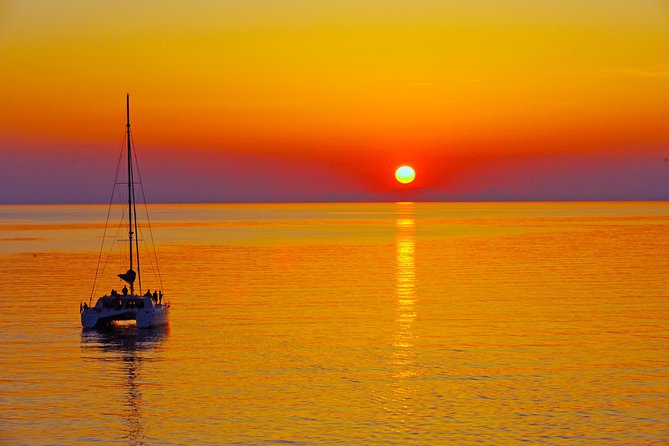 Santorini Sunset Luxury Sailing Catamaran Cruise with BBQ, drinks, transfer - Red Beach gives you the first swim