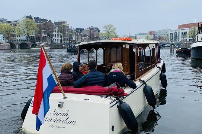 Small-Group Luxury Canal Cruise with Local Skipper - Anne Frank House gives the cruise a serious first landmark