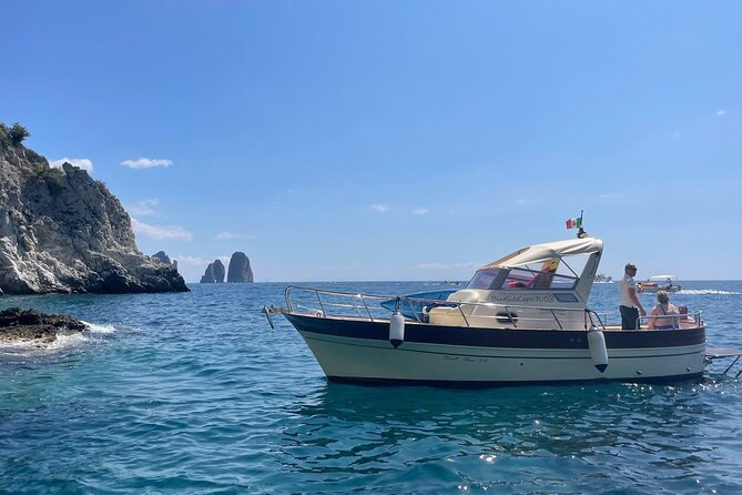 Three Hour Private Guided Tour of Capri with a luxury Gozzo cabin cruiser - Swimming, snorkeling, and comfort on board