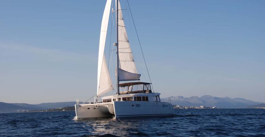 Tromsø: Fjord and Islands Luxury Catamaran Cruise - Mountain views from the Norwegian water