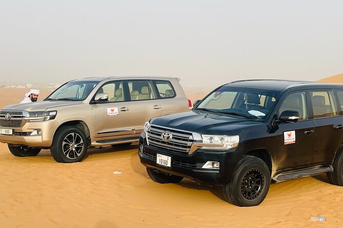 VIP Desert Safari with High Red Dune Bashing & Live BBQ Dinner - Sandboarding, photo stops, and the desert sunset
