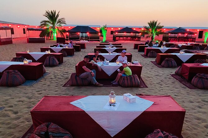 VIP Evening Desert Safari with Camel Ride & BBQ Dinner–Shared Car - Sandboarding and sunset photographs